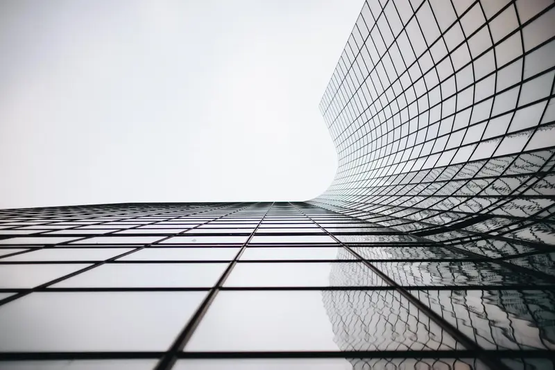 A curved glass facade catching the light.